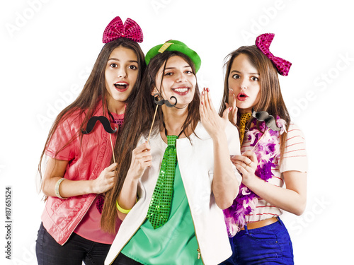 Attractive playful young women ready for parties. Lifestyle and the concept of friendship: a group of three girl friends