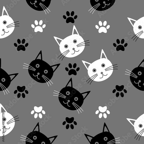 Seamless cartoon texture with the heads of cats.