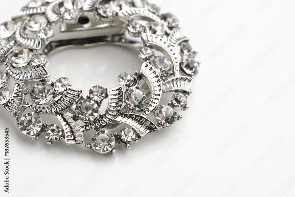 round brooch with diamonds isolated on white round brooch with diamonds isolated on white