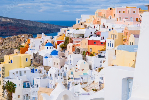 Oia town on Santorini island, Greece. Traditional and famous white and rose houses at sunny day