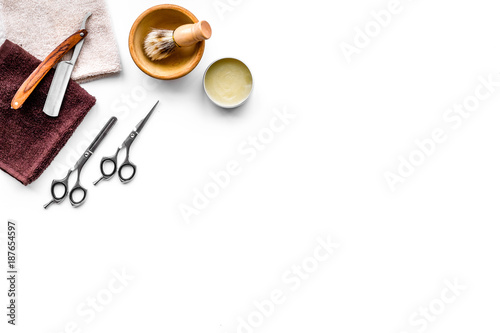 Tools beard and moustaches' care. Razor, brush and sciccors on white background top view copy space photo