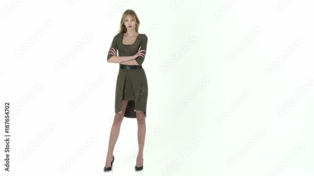 fashion model in green dress on a white background fashion model in green dress on a white background