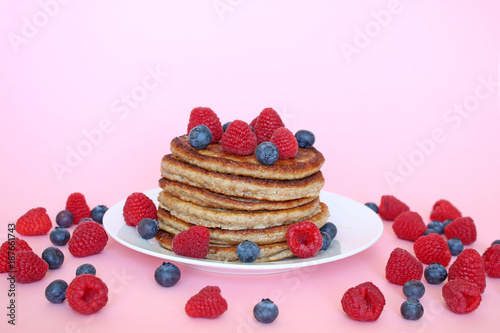 Homemade healthy pancakes with raspberries and blueberries