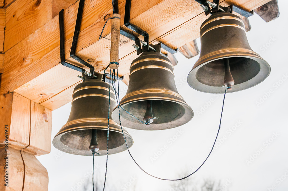 New bells in the bell tower of a wooden Church