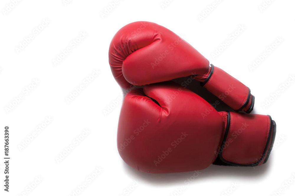 Leather box equipment for fight and training. Pair of boxing gloves lying on each other. Combat and fight concept. Boxing gloves in red color isolated on white background