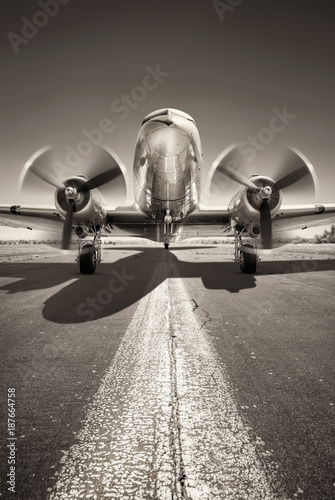 Canvas Print historic aircraft is waiting for take off on a runway