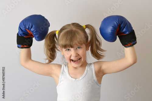 Kid boxer celebrates victory in the competition.