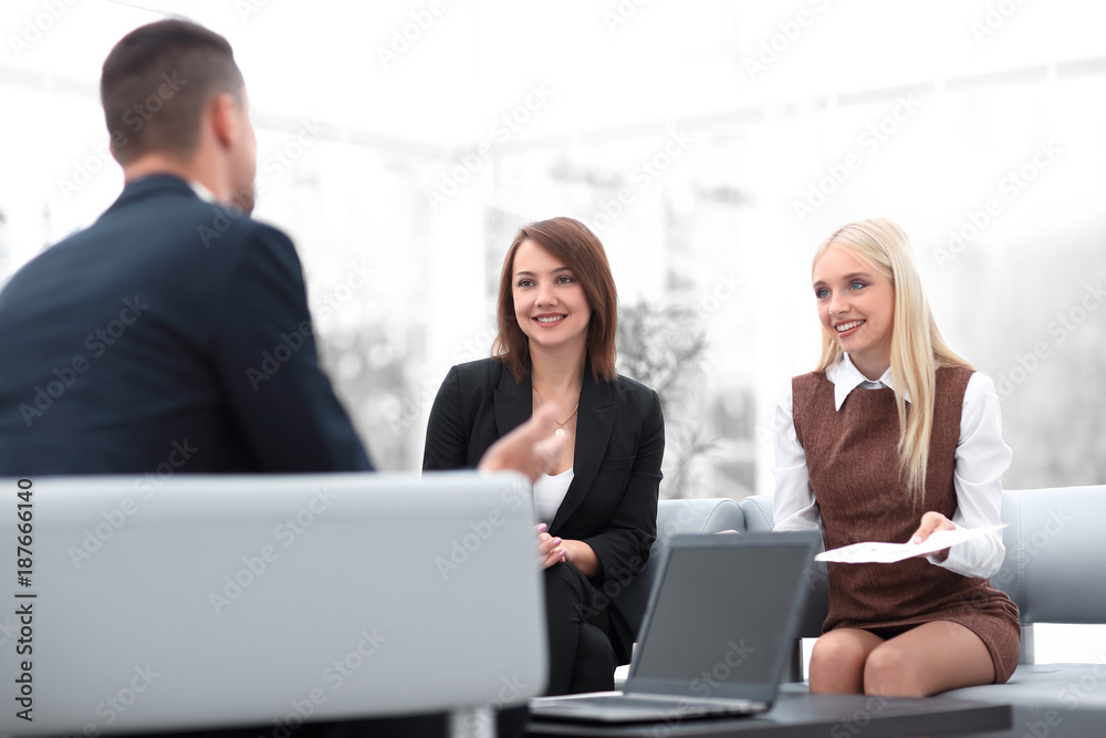 business team discussing business issues in office business team discussing business issues in office