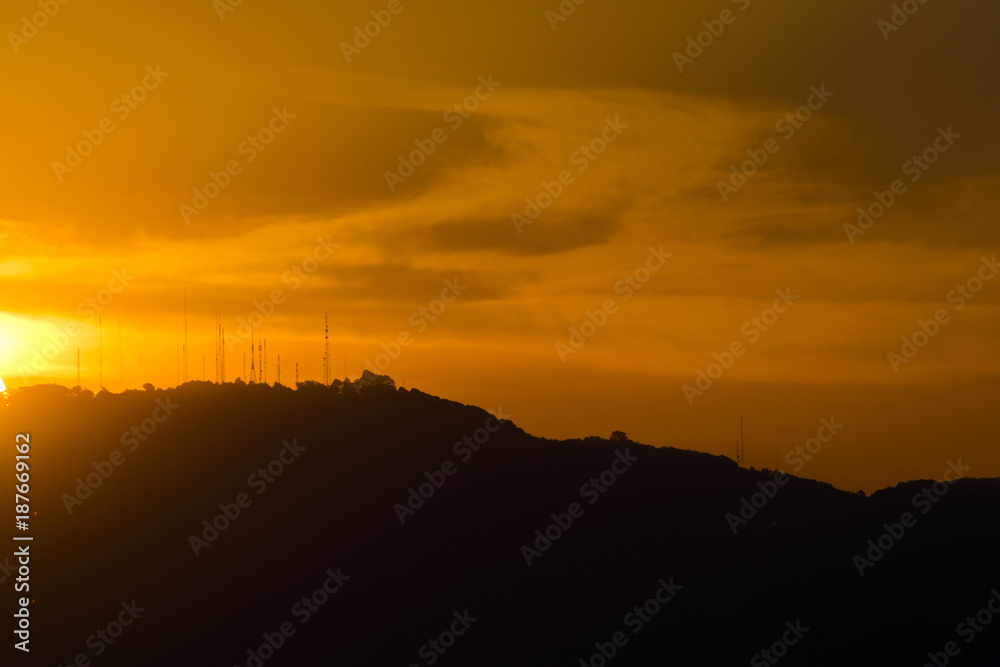 Sunset in Guatemala, mountain silhouette, communication antenna