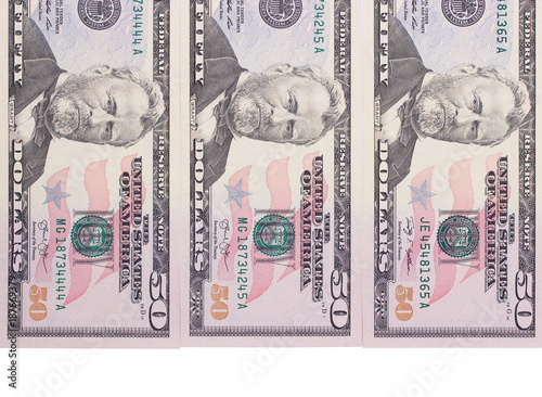 Three 50 dollar banknotes isolated on white background.