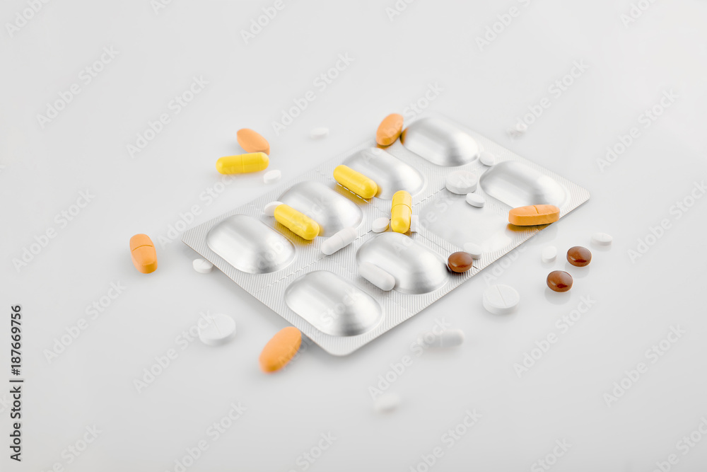 Medicines - saving lives. Assorted pharmaceutical medicine pills, tablets and capsules on white background.