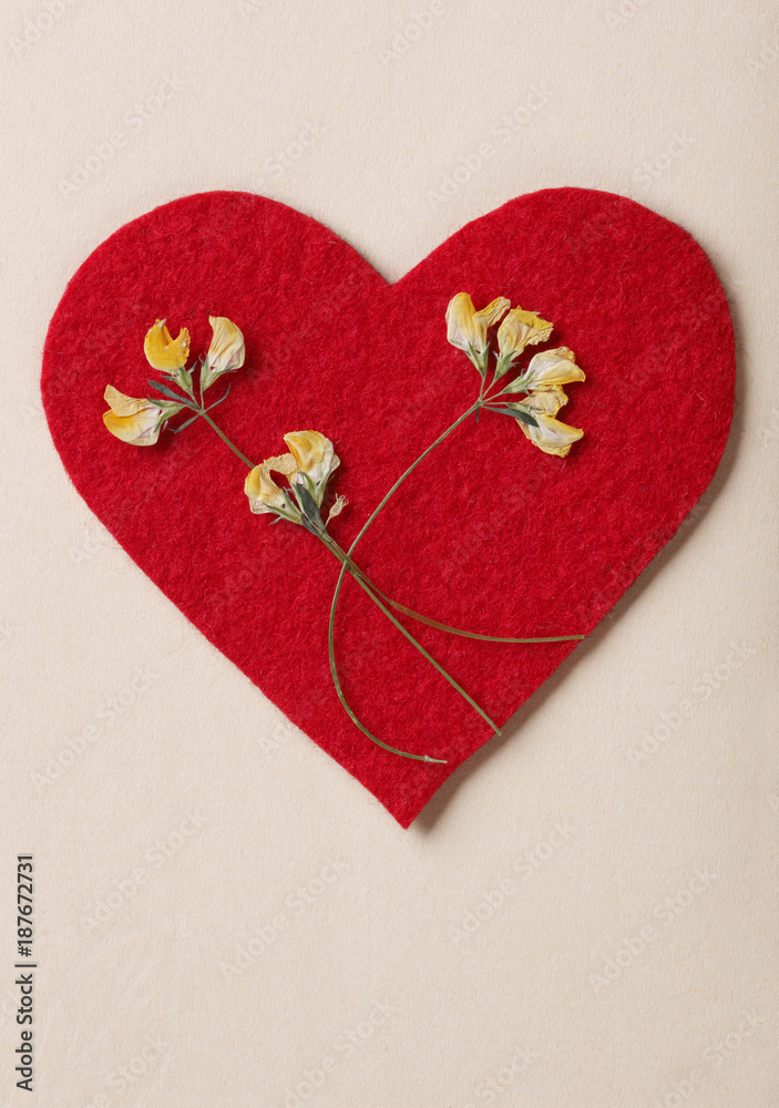 Red felt heart with yellow flowers