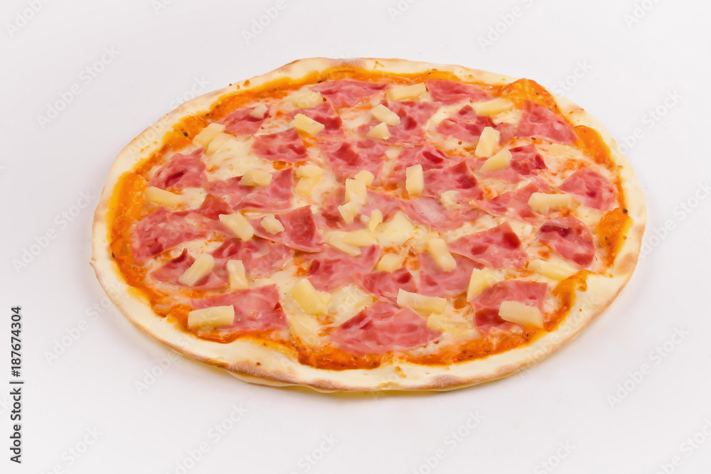 Pizza with ham and pineapple on a white background.
