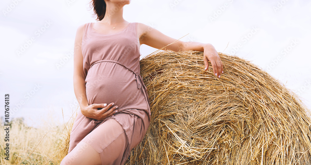 Beautiful pregnant woman in nature, outdoors. Beautiful pregnant woman in nature, outdoors.