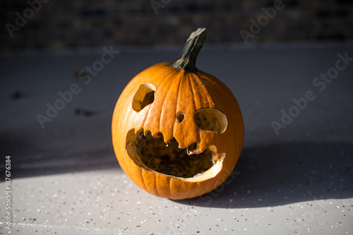 Close-up of jack o lantern on footpath