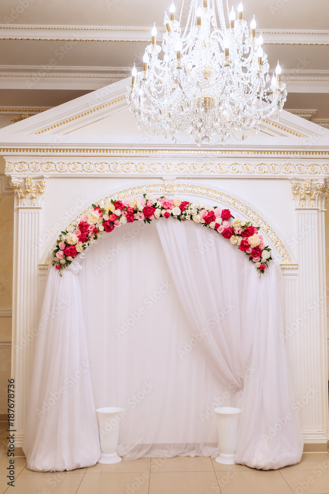 The wedding photographer's area is decorated with tulle and flowers The wedding photographer's area is decorated with tulle and flowers