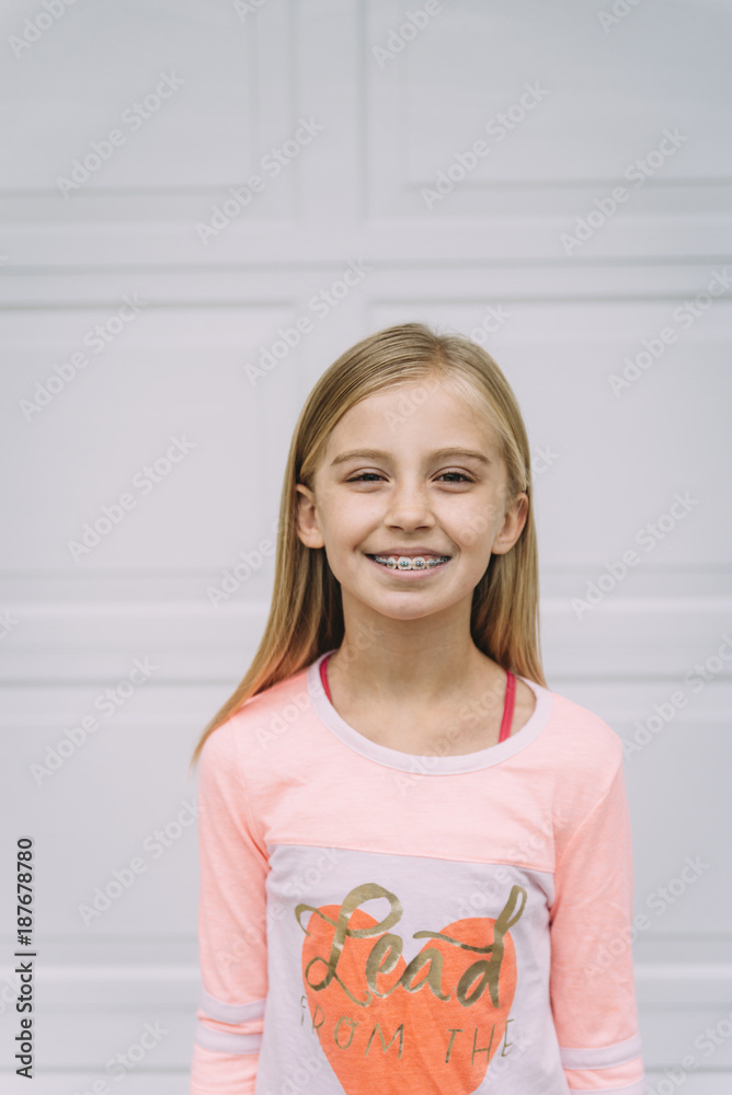 Portrait of smiling girl standing against door Portrait of smiling girl standing against door