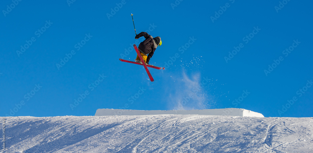 Ski rider jumping on mountains. Extreme winter sport