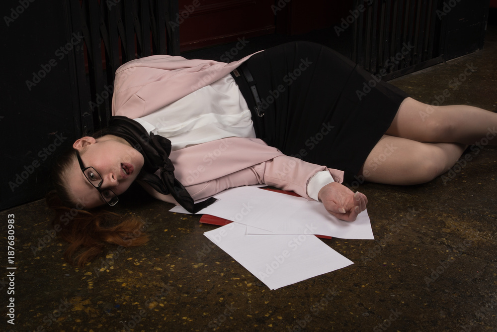 Fototapeta premium Business woman strangled by scarf in old elevator