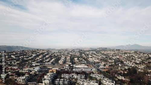 Beautiful 4k aerial drone bird eye panorama view on small commuter town house city neighborhood in cloudy sky cityscape