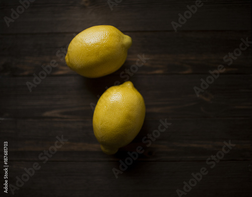 Overhead view of lemons on wooden table photo