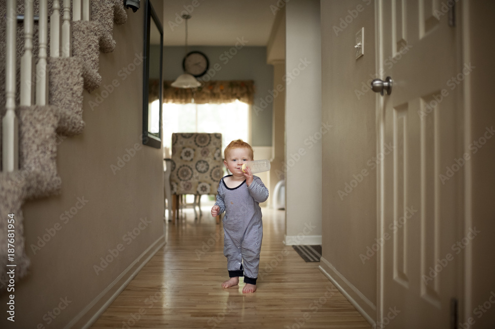 Portrait of baby boy drinking milk from baby bottle at home Portrait of baby boy drinking milk from baby bottle at home
