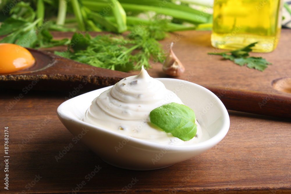 mayonnaise sauce on a wooden background cooking mayonnaise sauce on a wooden background cooking
