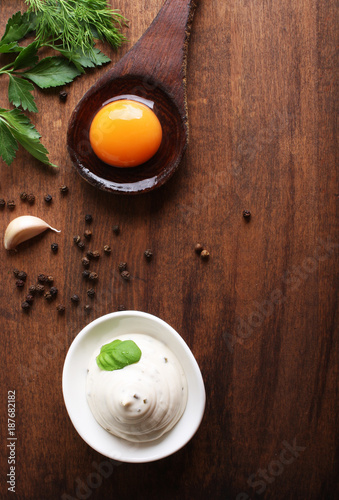 mayonnaise sauce on a wooden background cooking