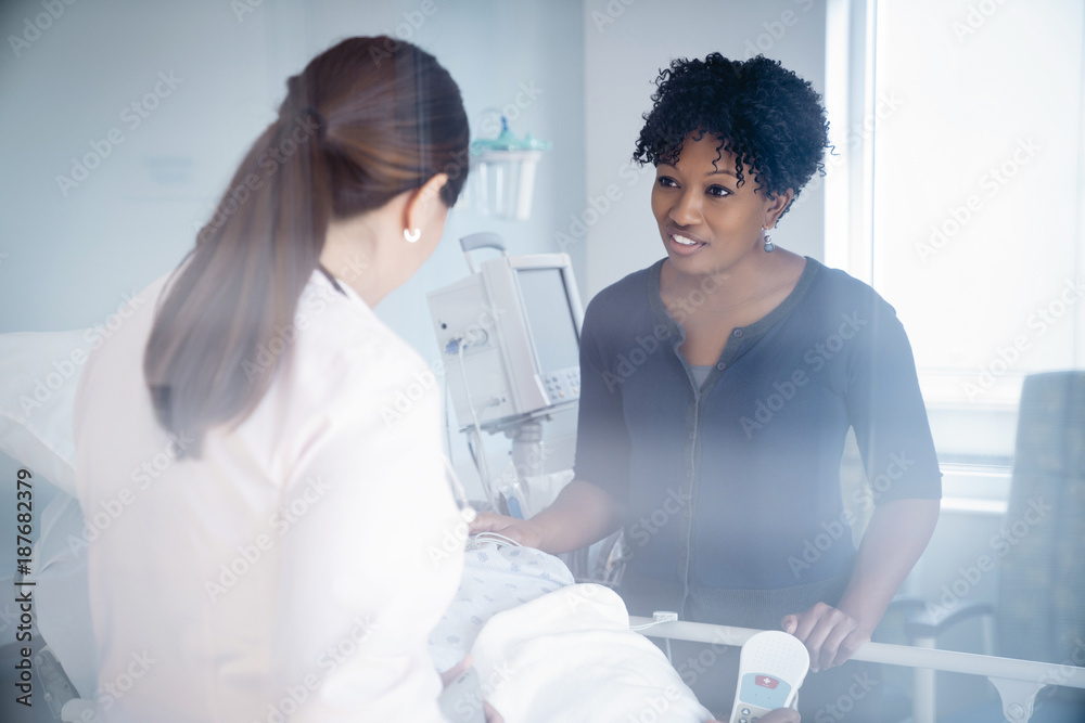 Woman talking with doctor in hospital Woman talking with doctor in hospital