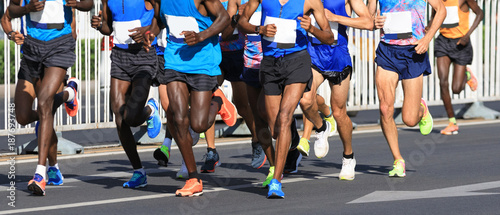 marathon runner legs running on city road
