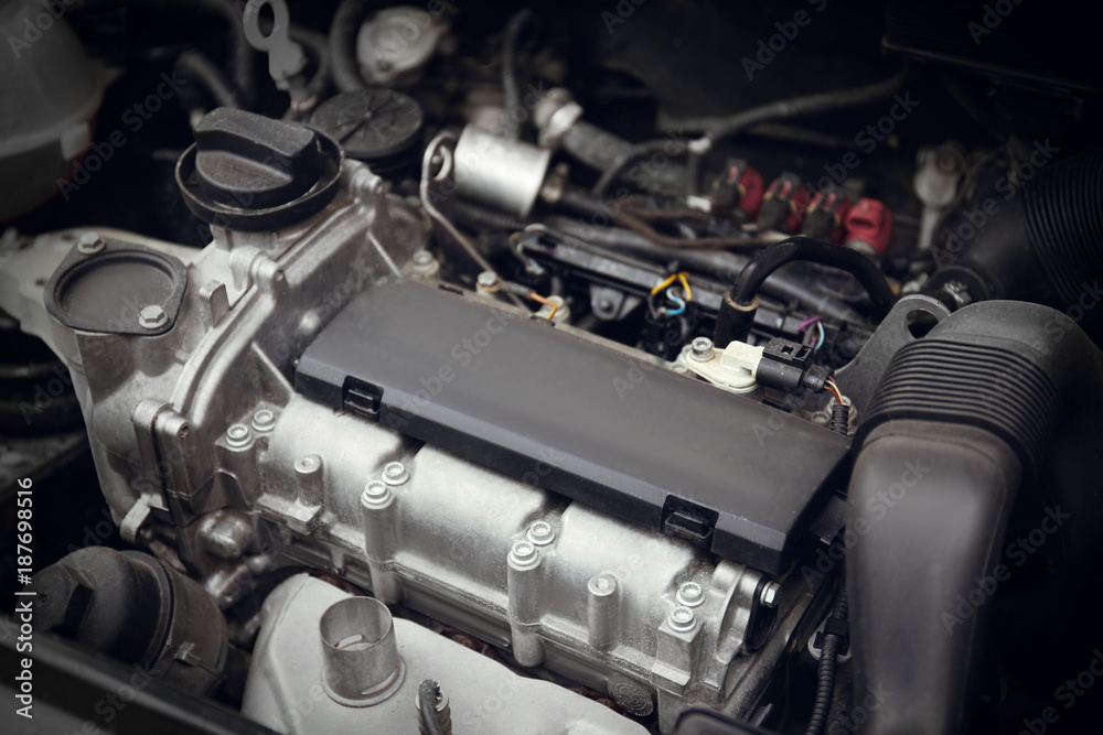 Fototapeta premium Closeup view of car engine. Auto mechanic service