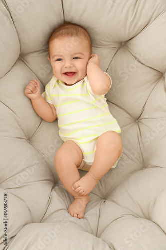 Cute little baby lying on l...