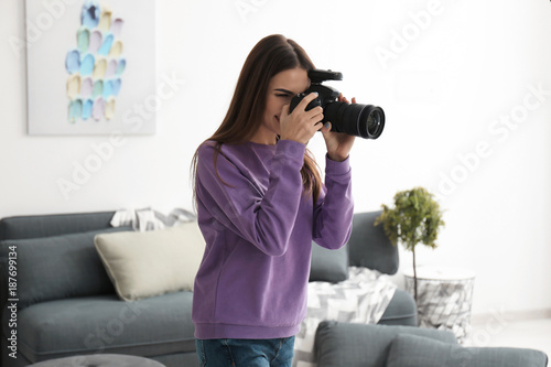 Young female photographer i...