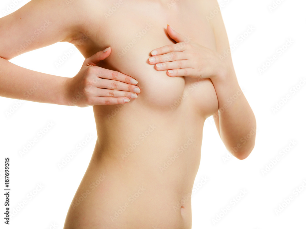 Woman examining her breasts for breast cancer Woman examining her breasts for breast cancer