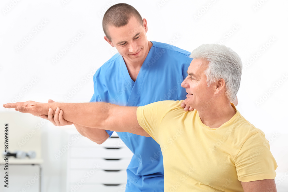 Physiotherapist working with patient in rehabilitation centre Physiotherapist working with patient in rehabilitation centre
