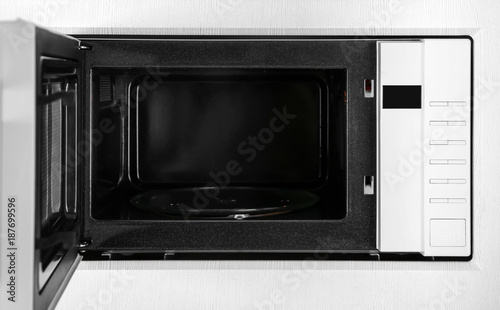 New white microwave oven in kitchen, closeup