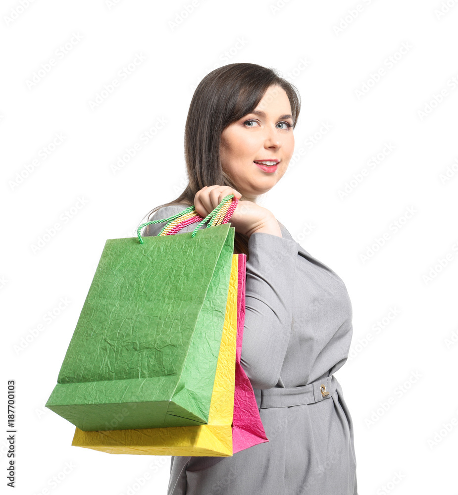 Beautiful overweight woman with shopping bags on white background Beautiful overweight woman with shopping bags on white background