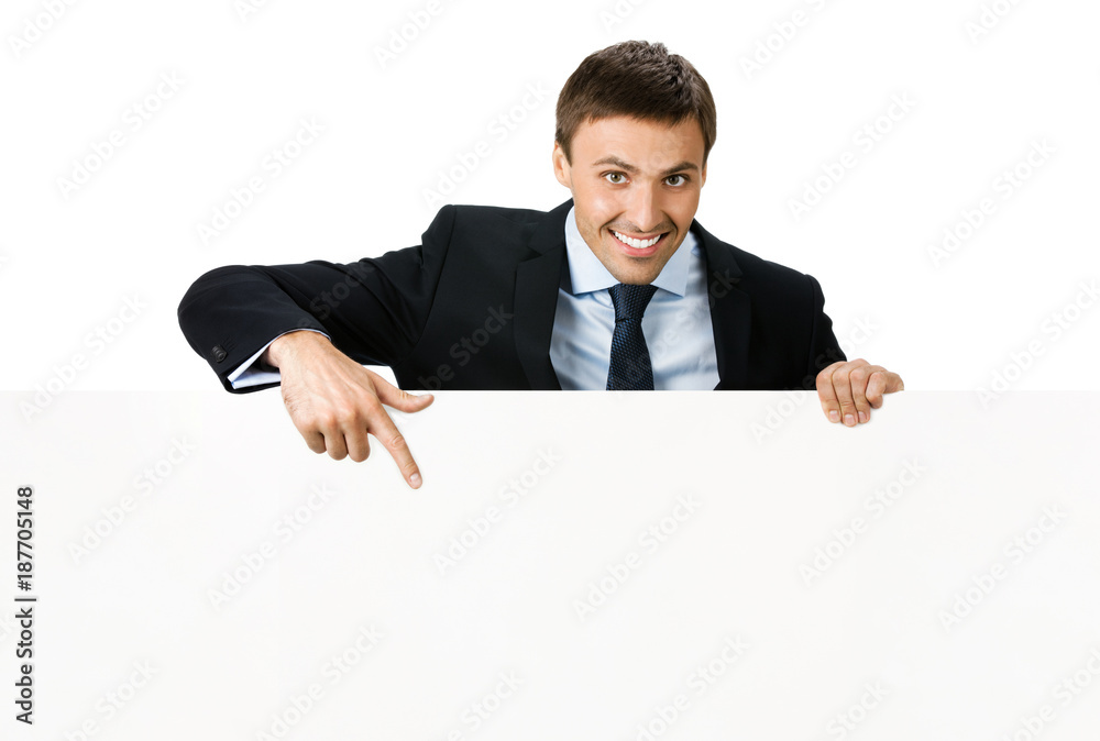 Happy businessman showing signboard, isolated Happy businessman showing signboard, isolated
