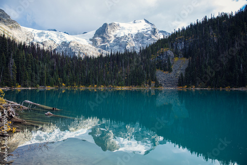 Second lake Joffre Lake Provincial Park. Pemberton British Columbia Canada. Glacial mountain and forest reflection on the lake. Blue natural lake water. photo