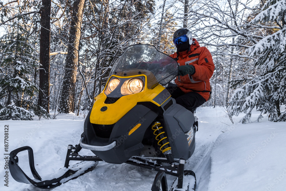 Athlete on a snowmobile.