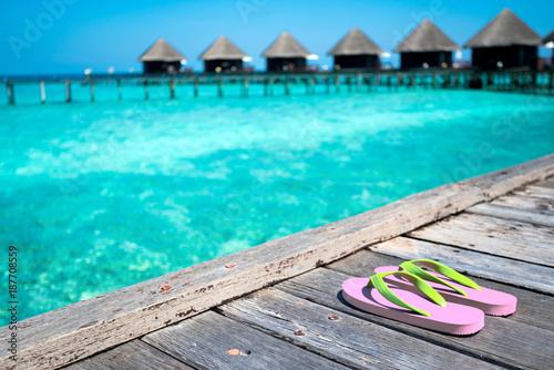 Sandals on the beautiful beach - summer vacation