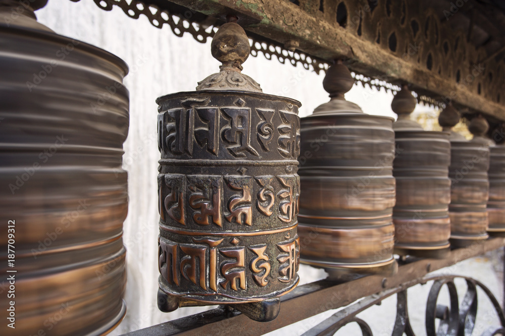 Prayer wheels made from metal at Swayambhunath Temple - Monkey Temple, Kathmandu, Nepal Prayer wheels made from metal at Swayambhunath Temple - Monkey Temple, Kathmandu, Nepal