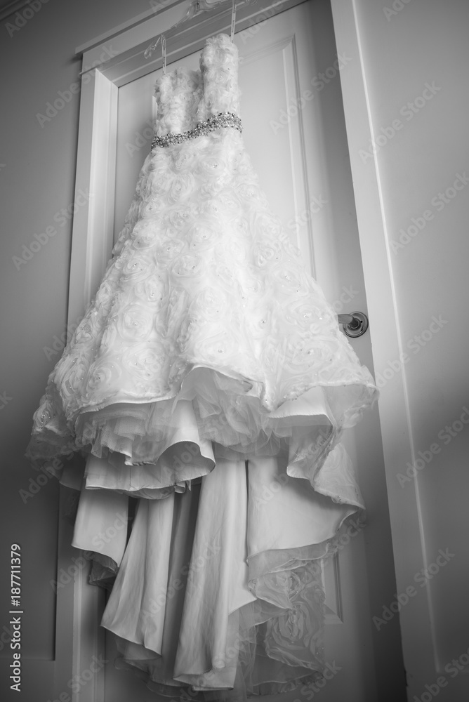 Wedding dress hanging on a door