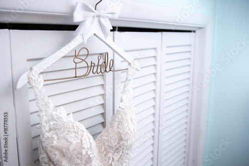Wedding Dress hanging on Hanger with the word Bride