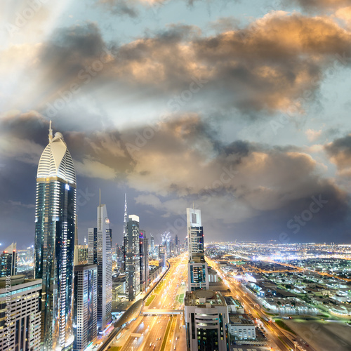 Downrtown skyline along Sheikh Zayed Road at night, Dubai photo