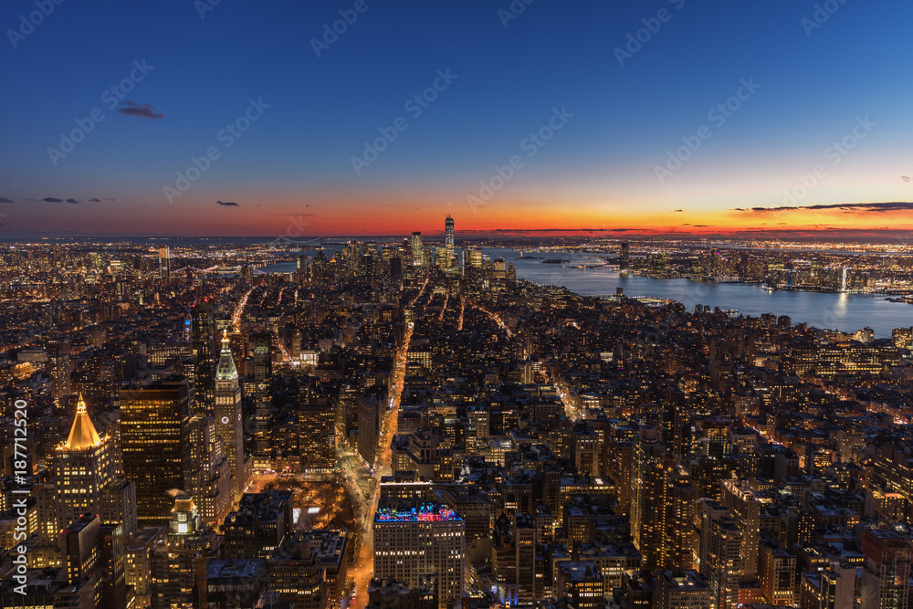 Fototapeta premium New York City skyline aerial panorama view at night with Times Square and skyscrapers of midtown Manhattan.