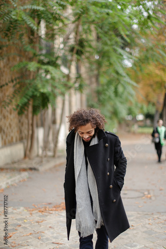 Good looking half Nigerian guy strolling. photo