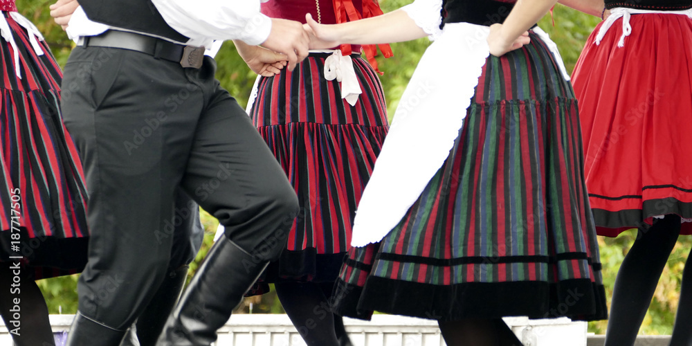 Folk dancer boys and girls in black, red and white - thematic background