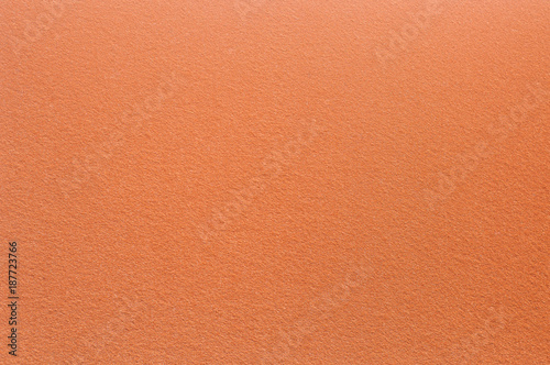 Felt surface in orange color. Abstract background and texture for design. © Iryna