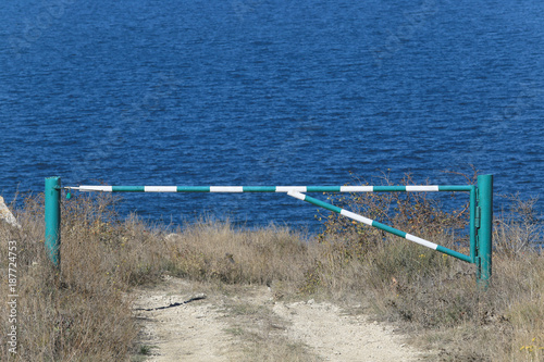barrier on the road near the sea